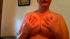 who know this woman at huge breasts?