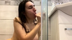 sucking dildo in the shower